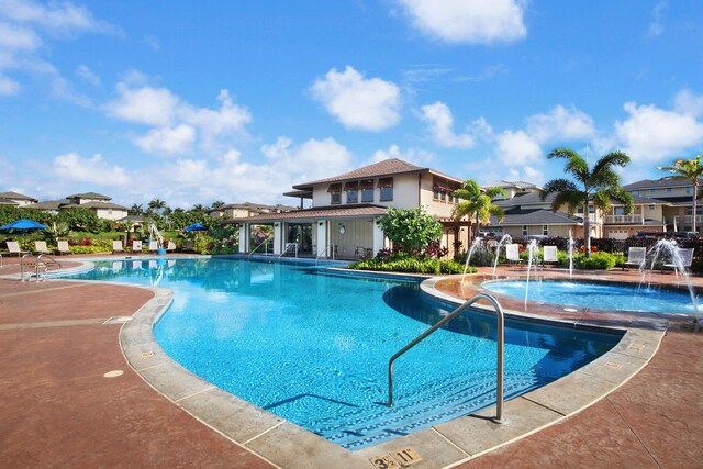 2611 Kiahuna Plantation Dr Unit 15G, Koloa, HI 96756 - community pool with a patio area and a residential view
