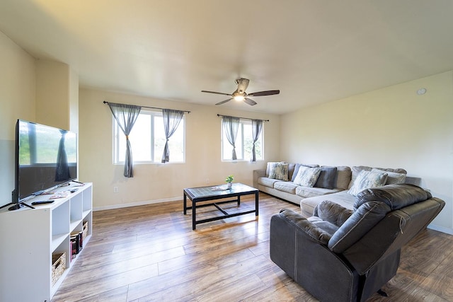 15-1702 11th Ave, Keaau, HI 96749 - living room with a ceiling fan, light wood-style flooring, and baseboards