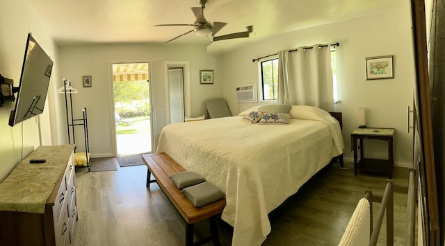 15-1988 1st Ave, Akala Keaau, HI 96749 - bedroom featuring dark wood-type flooring, access to exterior, and multiple windows