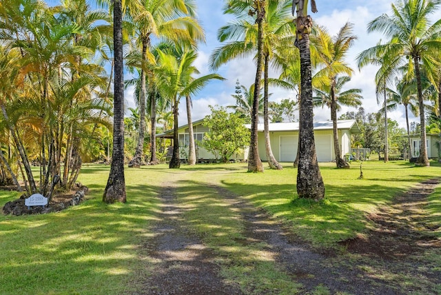 15-1988 1st Ave, Akala Keaau, HI 96749 - view of home's community with a yard and a garage