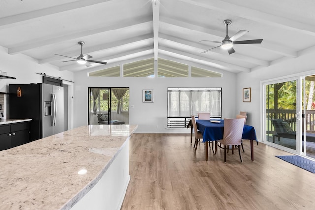 15-1988 1st Ave, Akala Keaau, HI 96749 - kitchen with a barn door, a ceiling fan, stainless steel fridge, and light wood-type flooring