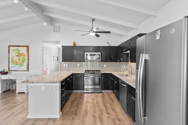 15-1988 1st Ave, Akala Keaau, HI 96749 - kitchen featuring appliances with stainless steel finishes, dark cabinets, a peninsula, and light wood-type flooring