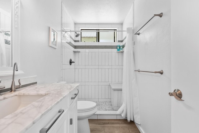 15-1988 1st Ave, Akala Keaau, HI 96749 - full bathroom featuring vanity, a stall shower, wood finished floors, and a textured ceiling