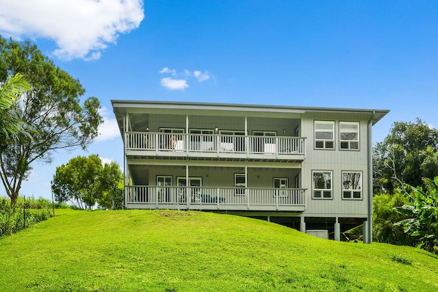 3968 Pai St, Kalaheo, HI 96741 - back of house featuring a lawn and a balcony