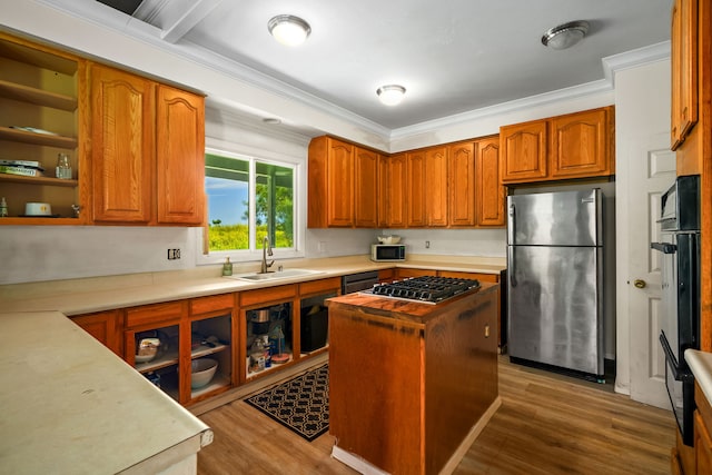 3968 Pai St, Kalaheo, HI 96741 - kitchen with appliances with stainless steel finishes, a sink, wood finished floors, crown molding, and light countertops