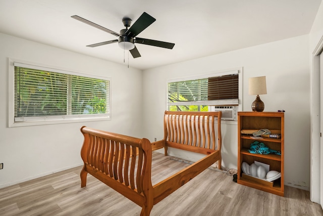 3968 Pai St, Kalaheo, HI 96741 - bedroom featuring wood finished floors, a ceiling fan, baseboards, and cooling unit