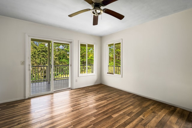 3968 Pai St, Kalaheo, HI 96741 - empty room with plenty of natural light, wood finished floors, and baseboards