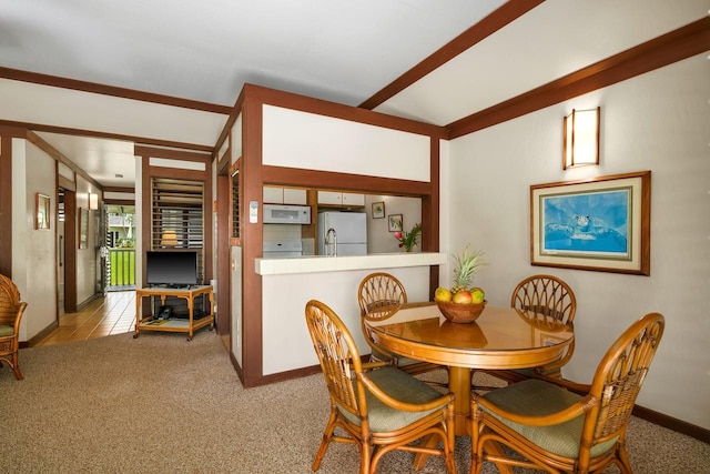 2253 Poipu Rd Unit 67, Koloa, HI 96756 - dining room with carpet floors, baseboards, and lofted ceiling