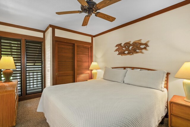 2253 Poipu Rd Unit 67, Koloa, HI 96756 - bedroom featuring a closet, carpet flooring, crown molding, and a ceiling fan