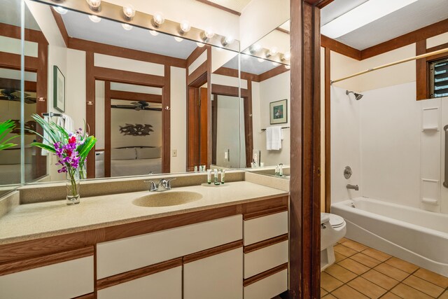 2253 Poipu Rd Unit 67, Koloa, HI 96756 - full bath featuring toilet, tile patterned flooring, shower / tub combination, vanity, and a ceiling fan