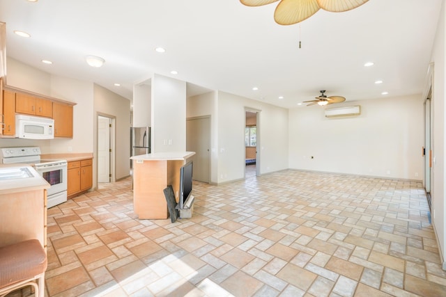 1-3580 Kaumualii Hwy, Hanapepe, HI 96716 - kitchen featuring white appliances, ceiling fan, a wall unit AC, light countertops, and open floor plan