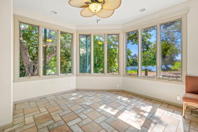 1-3580 Kaumualii Hwy, Hanapepe, HI 96716 - unfurnished sunroom with stone finish flooring and baseboards