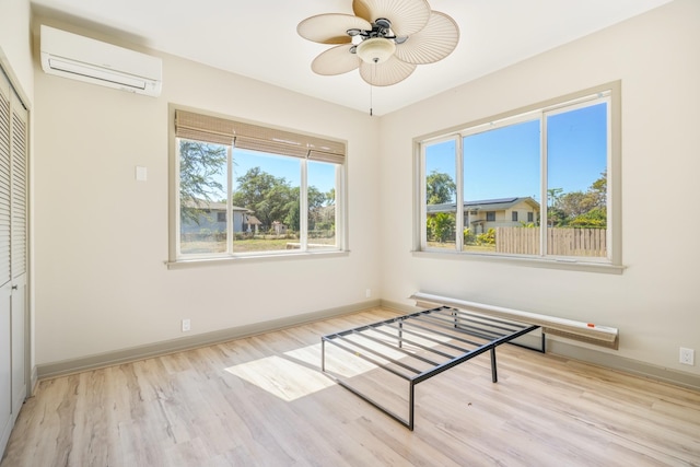 1-3580 Kaumualii Hwy, Hanapepe, HI 96716 - unfurnished bedroom with a wall mounted air conditioner, wood finished floors, and multiple windows