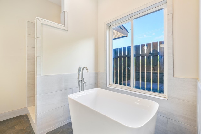 1-3580 Kaumualii Hwy, Hanapepe, HI 96716 - full bathroom featuring a soaking tub and tile walls
