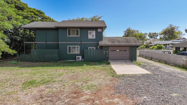 1-3580 Kaumualii Hwy, Hanapepe, HI 96716 - rear view of property with concrete driveway, an attached garage, and roof with shingles