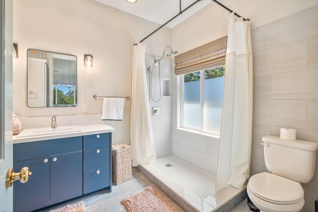 1-3580 Kaumualii Hwy, Hanapepe, HI 96716 - full bathroom featuring vanity, a tile shower, toilet, and tile patterned flooring