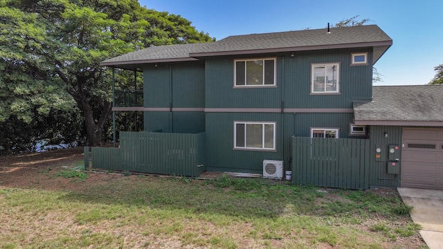1-3580 Kaumualii Hwy, Hanapepe, HI 96716 - view of home's exterior with ac unit, a shingled roof, and an attached garage
