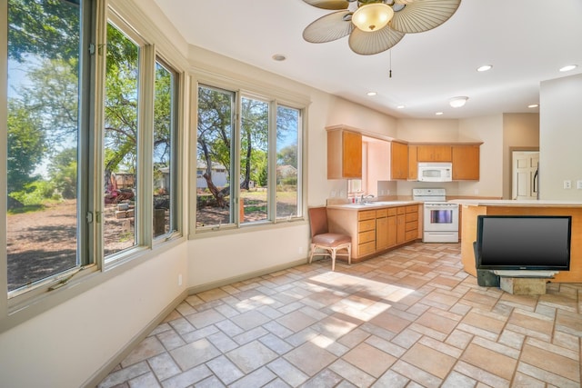 1-3580 Kaumualii Hwy, Hanapepe, HI 96716 - kitchen featuring white appliances, light countertops, a ceiling fan, a sink, and stone tile floors