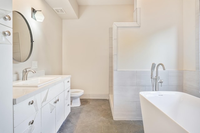 1-3580 Kaumualii Hwy, Hanapepe, HI 96716 - bathroom with a soaking tub, vanity, toilet, and baseboards