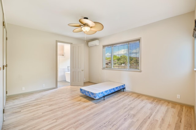 1-3580 Kaumualii Hwy, Hanapepe, HI 96716 - bedroom with a wall unit AC, light wood-type flooring, baseboards, and connected bathroom