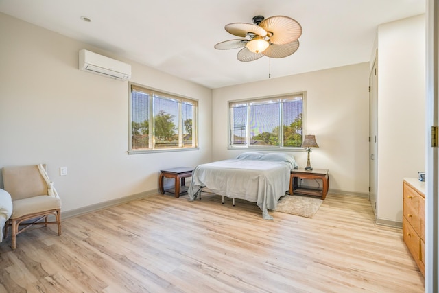 1-3580 Kaumualii Hwy, Hanapepe, HI 96716 - bedroom featuring a wall mounted AC, light wood-style flooring, baseboards, and ceiling fan