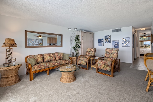 75-5782 Kuakini Hwy Unit 504, Kailua-Kona, HI 96740 - carpeted living room featuring a ceiling fan and a textured ceiling