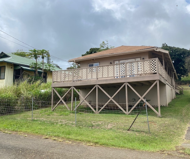 95-1214 Ohai Rd, Naalehu, HI 96772 - back of house with a deck and stucco siding