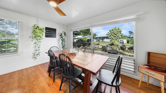3189 Hikina Rd, Koloa, HI 96756 - dining space with light wood finished floors, ceiling fan, and a decorative wall