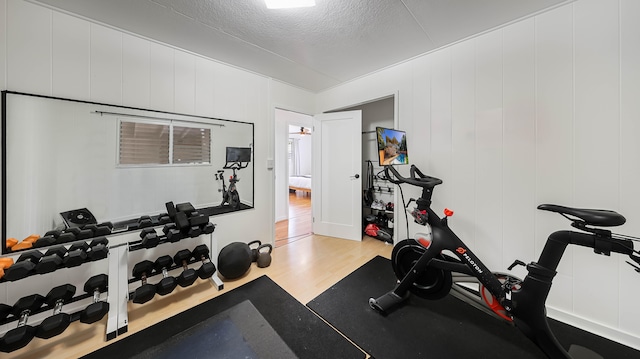 3189 Hikina Rd, Koloa, HI 96756 - exercise room with wood finished floors and a textured ceiling
