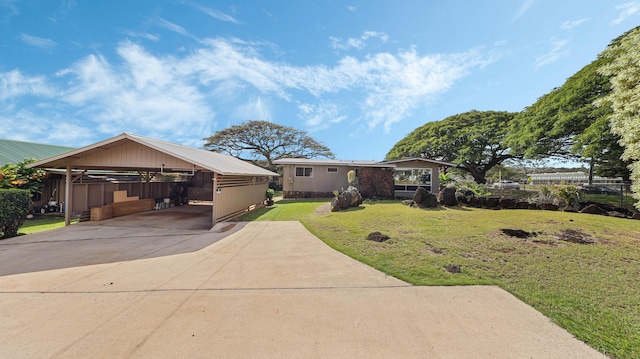 3189 Hikina Rd, Koloa, HI 96756 - view of front facade with a front lawn, driveway, and an attached carport