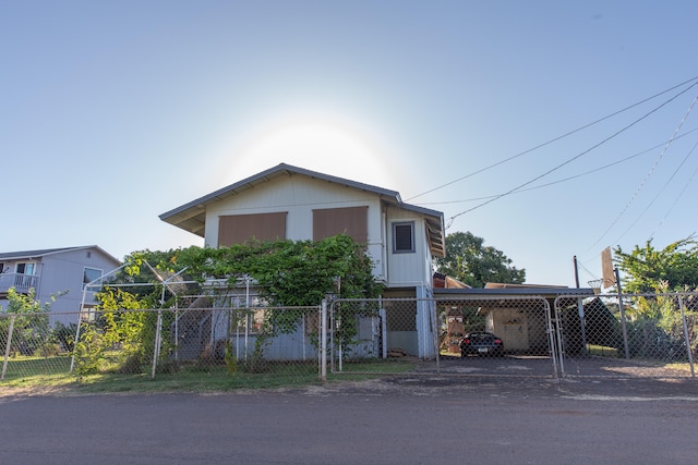 4486 Iona Rd, Hanapepe, HI 96716 - view of front of home featuring a carport, a fenced front yard, and dirt driveway