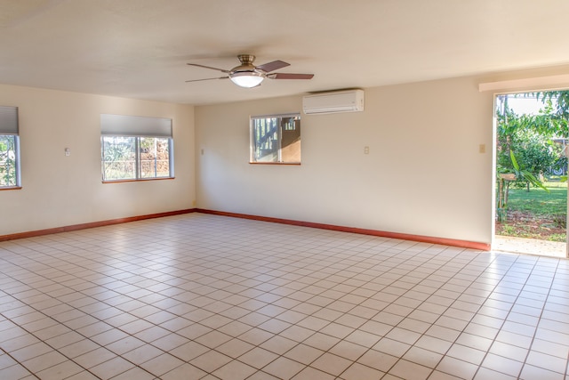 4486 Iona Rd, Hanapepe, HI 96716 - spare room featuring a wall unit AC, plenty of natural light, ceiling fan, and baseboards