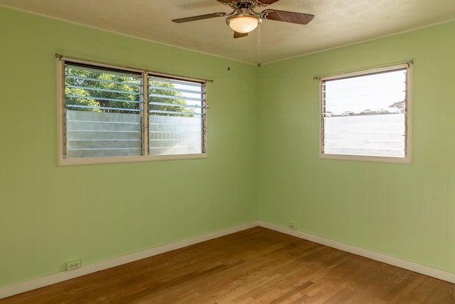 4486 Iona Rd, Hanapepe, HI 96716 - spare room with wood finished floors, a ceiling fan, and baseboards