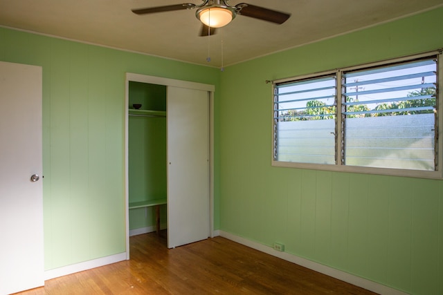 4486 Iona Rd, Hanapepe, HI 96716 - unfurnished bedroom featuring wood finished floors, a closet, baseboards, and a ceiling fan