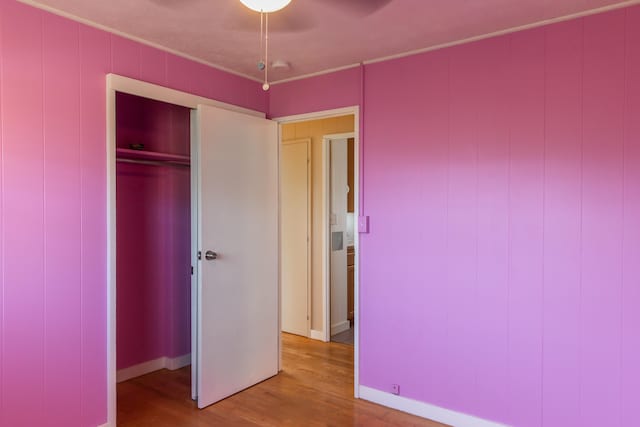4486 Iona Rd, Hanapepe, HI 96716 - unfurnished bedroom with wood finished floors, a closet, and ceiling fan