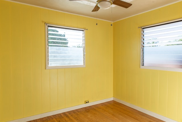 4486 Iona Rd, Hanapepe, HI 96716 - spare room with healthy amount of natural light, wood finished floors, a ceiling fan, crown molding, and baseboards
