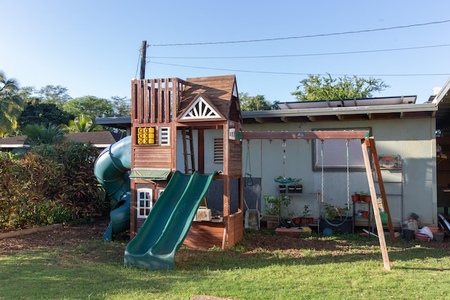 4486 Iona Rd, Hanapepe, HI 96716 - view of jungle gym featuring a lawn