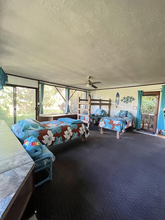 173 Opio Rd, Hilo, HI 96720 - bedroom with a textured ceiling, carpet, and access to outside