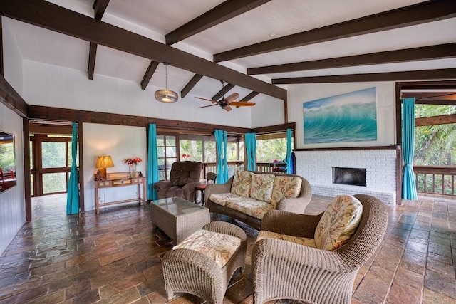 173 Opio Rd, Hilo, HI 96720 - living room featuring stone tile floors, a ceiling fan, a fireplace, and healthy amount of natural light