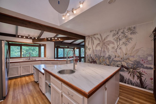 173 Opio Rd, Hilo, HI 96720 - kitchen with freestanding refrigerator, a sink, light wood finished floors, beam ceiling, and track lighting