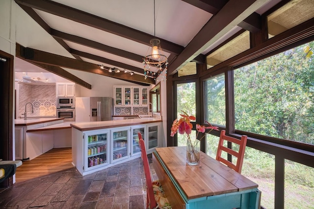 173 Opio Rd, Hilo, HI 96720 - dining room featuring a chandelier and stone tile floors