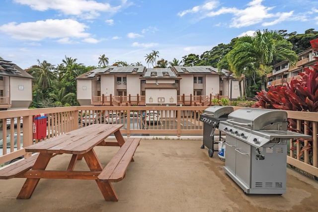 3411 Wilcox Rd Unit Aiii9, Lihue, HI 96766 - view of patio featuring a grill, a balcony, and a residential view