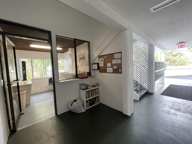 75-5680 Kuakini Hwy Unit 203, Kailua-Kona, HI 96740 - hall featuring plenty of natural light and a textured ceiling