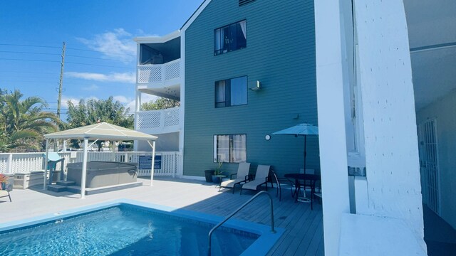 75-5680 Kuakini Hwy Unit 203, Kailua-Kona, HI 96740 - view of pool with a gazebo, a hot tub, and a patio area