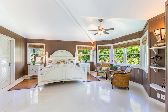 7359 Alealea Rd, Hanalei, HI 96714 - bedroom with wood finished floors, vaulted ceiling, a ceiling fan, and wood walls