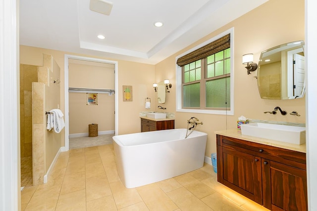 78-106 Holuakai St, Kailua-Kona, HI 96740 - full bathroom featuring a soaking tub, two vanities, a walk in shower, recessed lighting, and tile patterned floors
