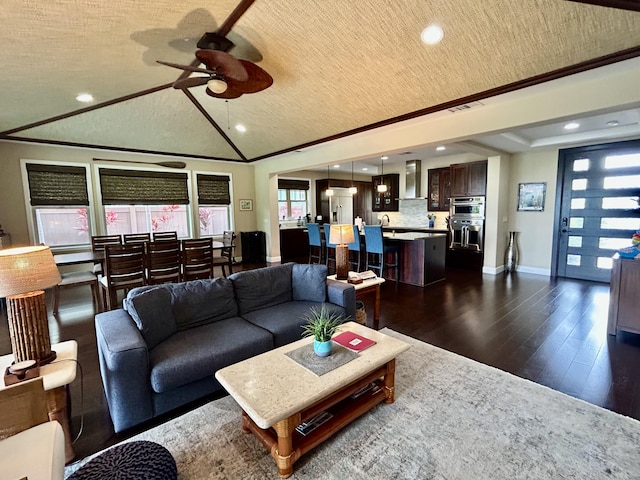78-106 Holuakai St, Kailua-Kona, HI 96740 - living area with recessed lighting, ceiling fan, dark wood finished floors, lofted ceiling, and crown molding