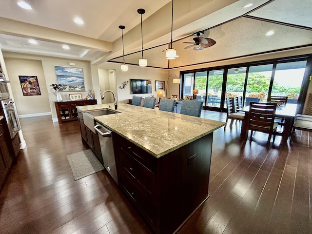 78-106 Holuakai St, Kailua-Kona, HI 96740 - kitchen with stainless steel dishwasher, dark wood-style floors, a ceiling fan, pendant lighting, and oven