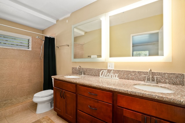 8562-B Elepaio Rd, Kekaha, HI 96752 - bathroom featuring toilet, a tile shower, double vanity, and tile patterned flooring