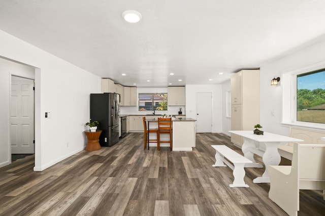 8562-B Elepaio Rd, Kekaha, HI 96752 - kitchen featuring stainless steel fridge with ice dispenser, healthy amount of natural light, dark wood-style floors, a center island, and recessed lighting